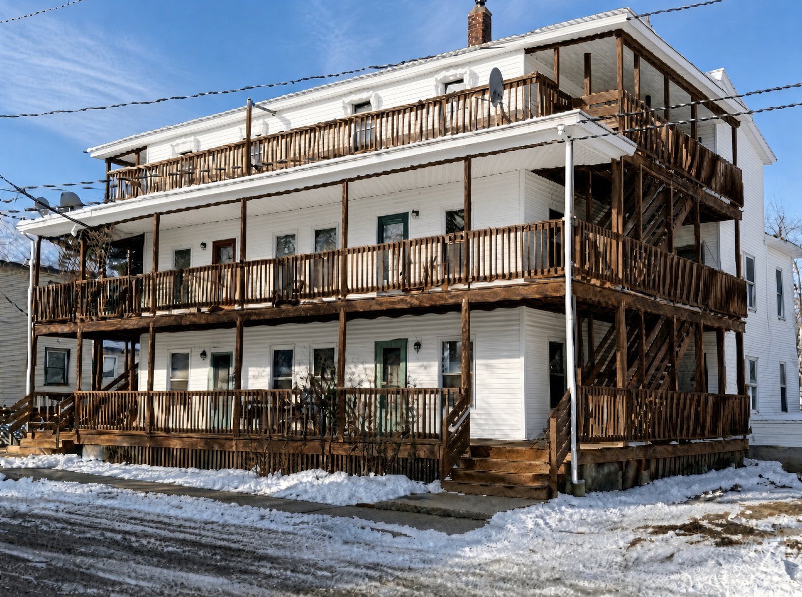 33 Prescott Street, Sanford, a three-story building with stacked porches